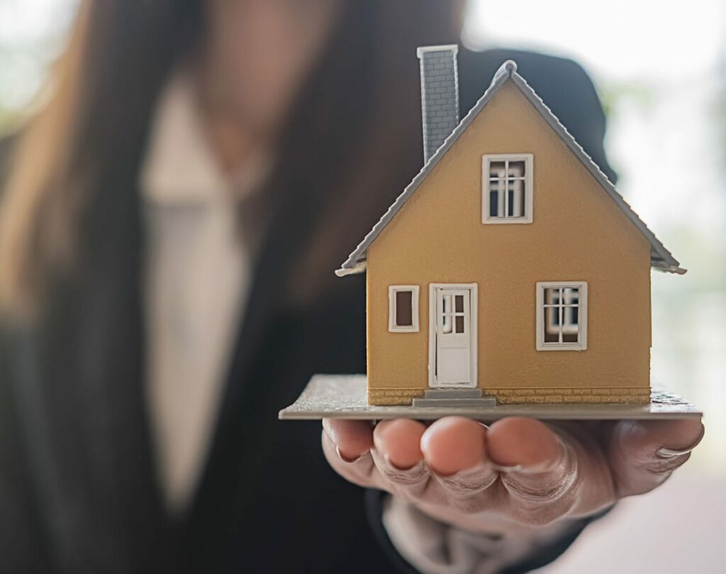 Lady holding house - Can divorce force the sale of my house?