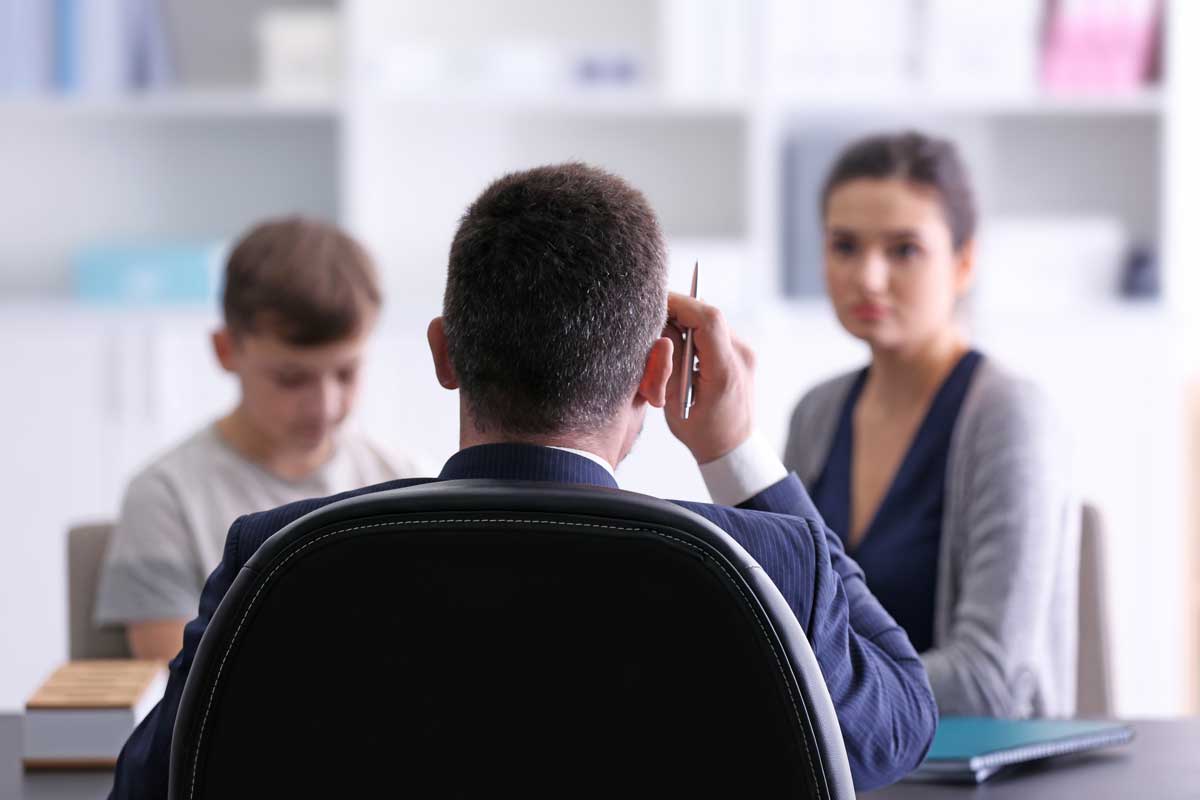 child and parent in meeting with solicitor about disputes over child arrangements