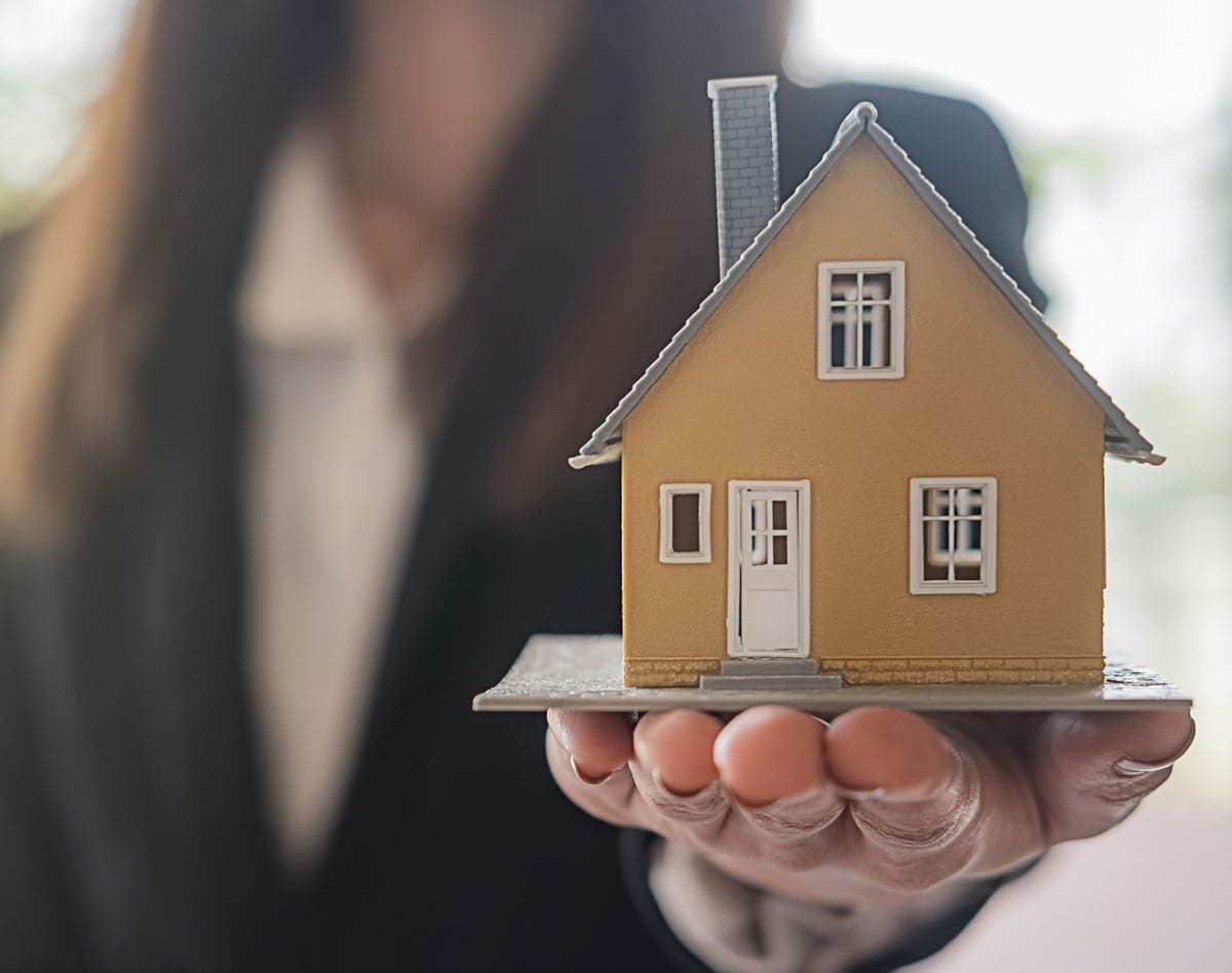 Lady holding house - Can divorce force the sale of my house?
