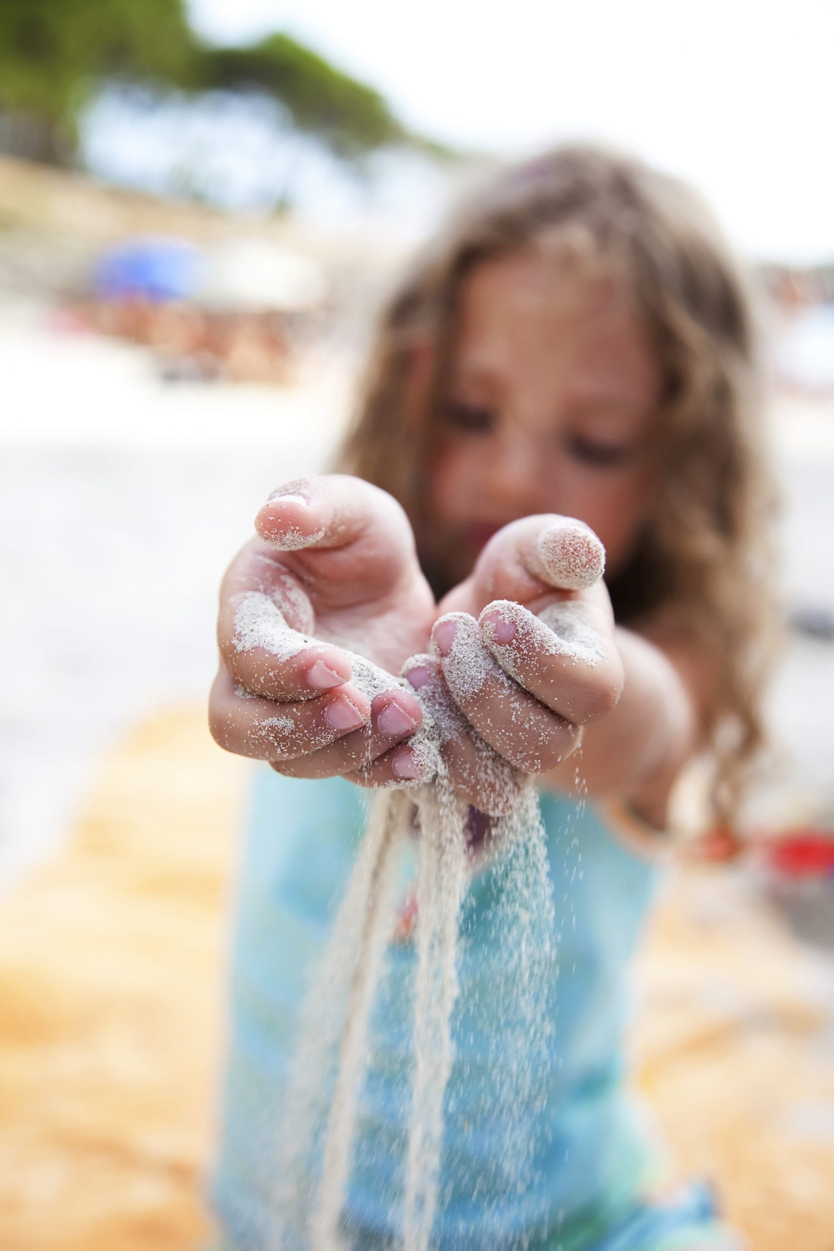 Girl with sand in her hands - What is parental alienation