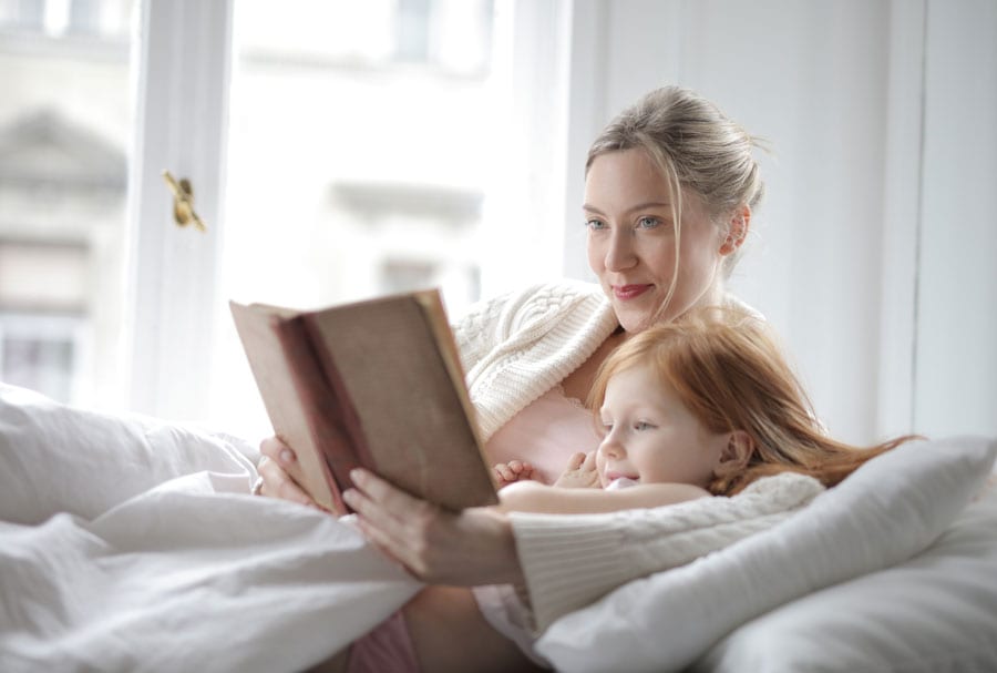 woman reading with child, divorce