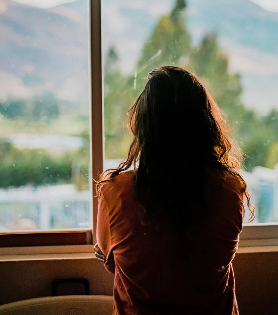 women looking out of window - domestic abuse solicitors